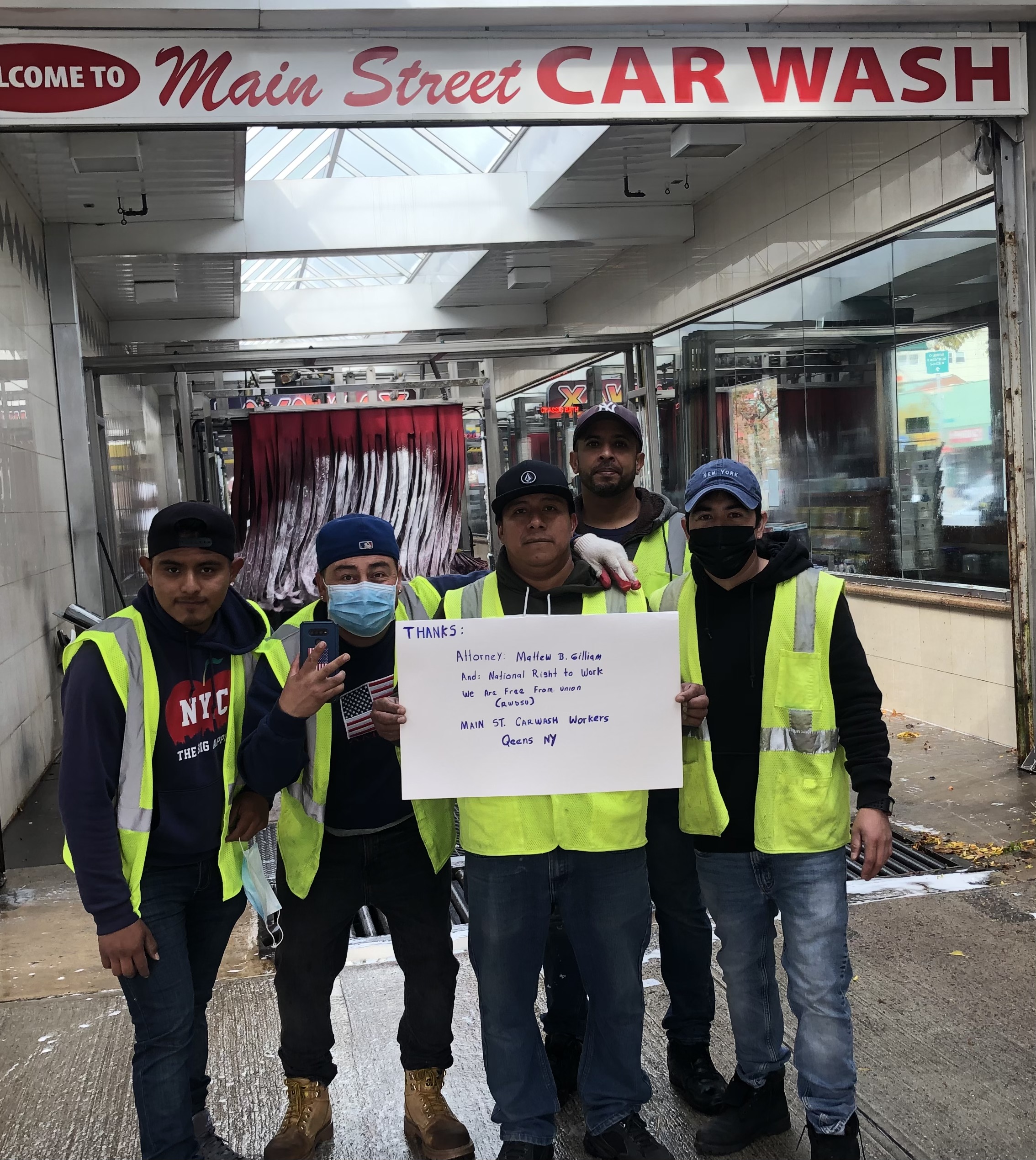 Main Street Car Wash worker Ervin Par (center) and his colleagues in NYC thank their National Right to Work Foundation attorney for helping them secure a vote to remove unwanted RWDSU union bosses from their workplace.